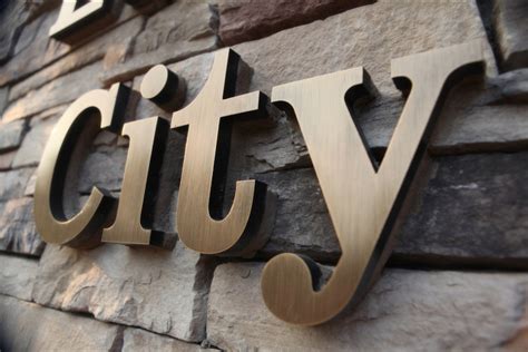 bronze colored metal fabricated letters|solid cut bronze signs.